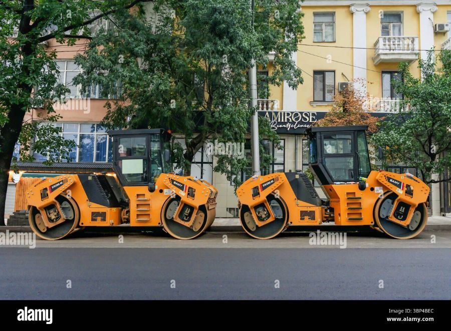 Two SANY road rollers laying asphalt for road construction projects